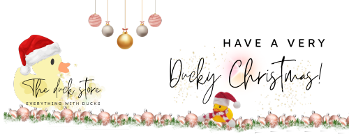 the duckstore logo with duck wearing santa hat, christmas decorations and the text have a very ducky christmas! and a rubber duck wearing a santa hat and scarf